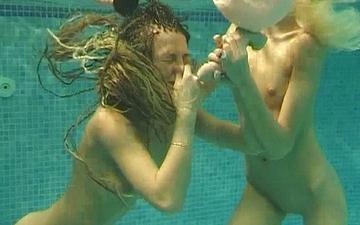 Download A couple of teen lesbians play in the pool before getting hardcore