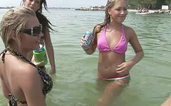 Watch a hot group of horny lesbians playing out in the water together join background