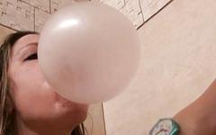 Marie Madison blows a bubble and pops it on her face - movie 3 - 4