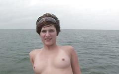 Doing a sexy striptease on the boat is capped with some big natural tits join background