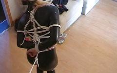 Blonde in black latex has her tits hanging out as she is bound in rope - movie 1 - 5