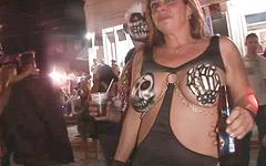 Wild partiers show lots of skin in public on the streets join background