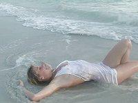 Sexy blonde amateur frolics in the surf and shows off her slender body - movie 8 - 5