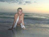 Sexy blonde amateur frolics in the surf and shows off her slender body - movie 8 - 7