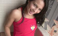 Ver ahora - Amabella fucks herself with a big red dildo on an armchair.