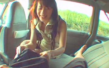 Download Asian chick sucks a dude's pipe in the car next to the road.