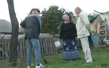 Download Lusty farm granny hikes her apron to sit on stiff young cock stud