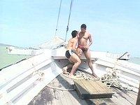 Watch Now - Boat anchored offshore holds two naked studs nailing each others' asses 