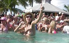 Watch Now - Sexy wet t-shirt contest around a stripper pole at beach party