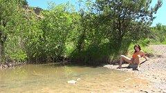 Susan plays with her wet pussy sitting on a rock at a secluded lake - movie 5 - 6