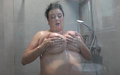 Miranda Steel has big grannie tits and she uses the shower head to cum - movie 4 - 2