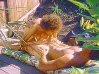 A sexy and busty girl with curly hair fucks her man outside on the deck - movie 1 - 4