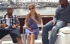 Ver ahora - A blonde girl on a boat gets laid by two black men at the same time